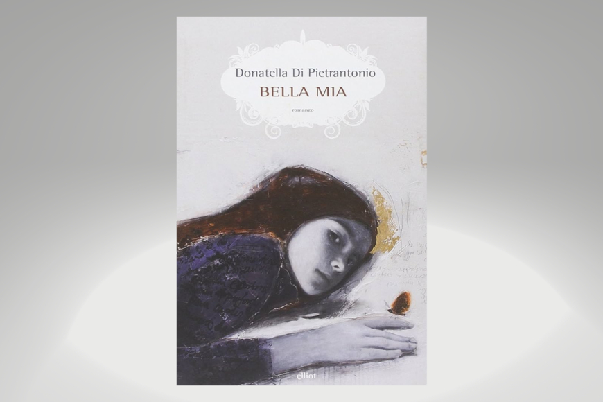 Book cover shows a colored drawing of a girl lying down. Her face is shaded grayscale, her hair is dark and straight and her sweater is purple. She is watching the viewer intently.
