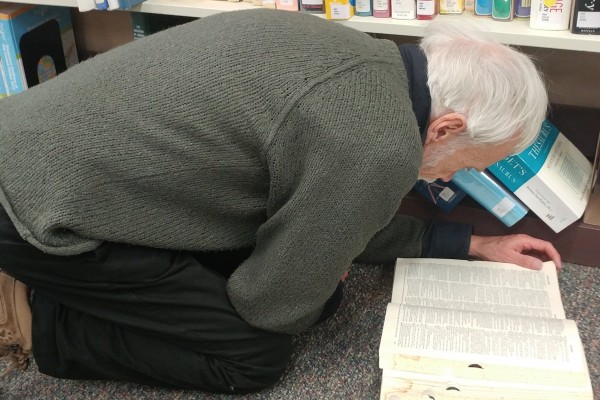 Man reading on floor