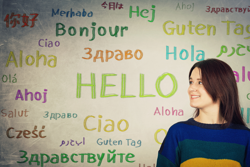 hello written in multiple languages on a whiteboarrd