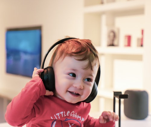A child listening to headphones